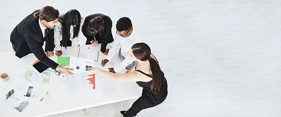 Image showing Meeting, finance and collaboration with a business team working around a table in the boardroom from above. Accounting, documents and teamwork with a man and woman employee group at work in an office