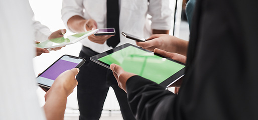 Image showing Hands, green screen and technology with a business team in studio isolated on a white background for communication or networking. Tablet, phone and mockup with an employee group on blank space