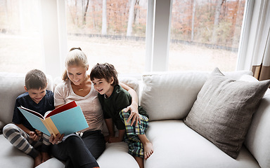 Image showing Books, reading and mother with kids on sofa for storytelling time in living room of happy home. Love, learning and woman with children, book and fantasy story on couch, growth and child development.