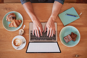 Image showing Laptop, coffee shop and above man hands writing email, freelance and internet with screen mockup. Hand, remote work and social media influencer in cafe for food, review or typing blog, search or web