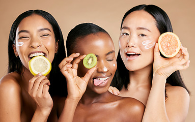 Image showing Face, fruit and women in portrait with cream for facial care, beauty and natural cosmetics isolated on studio background. Sunscreen, vegan and different skin with skincare, moisturizer and playful