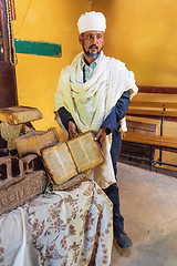 Image showing orthodox priest shows a holy bible, Ethiopia