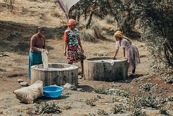 Image showing Ethiopian women wash clothes, Simien Mountain Ethiopia