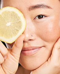 Image showing Skincare, beauty and portrait of an Asian woman with a lemon for body detox, health and wellness. Vitamin c, food and happy Japanese model with a fruit for diet, nutrition and vegan dermatology