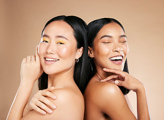 Image showing Women, beauty and makeup in studio for wellness, hygiene and creative grooming on brown background. Face, friends and eyeshadow by girl with different, skin and luxury skincare, relax and isolated