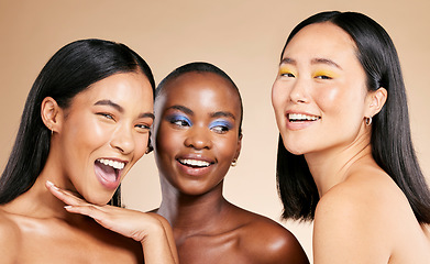 Image showing Diversity, beauty portrait and happy with makeup for cosmetics dermatology, skincare wellness and facial care in brown background studio. Women inclusion, model happiness smile and luxury face glow