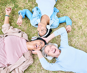 Image showing Top view, senior or people and music headphones in silent disco, retirement friends fun or bonding community wellness. Smile, happy or elderly women lying on nature park grass and listening to radio