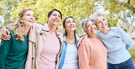 Image showing Senior women, people or bonding hug while bird watching in nature park, spring garden or relax environment. Smile, happy or diversity elderly friends in retirement support, trust or community social