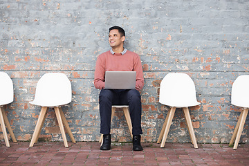 Image showing Recruitment, thinking and man on brick wall sitting in line with laptop for job opportunity, hr email and success. Computer, waiting room and person on Human Resources website for career application