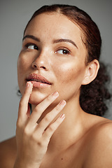 Image showing Sugar scrub, face and lips of woman in studio isolated on a gray background. Thinking, cosmetics and skincare of female model with lip dermatology product for exfoliation, cleaning and healthy skin.