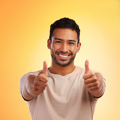 Image showing Happy man, thumbs up and like emoji portrait with smile and hands for advertising sale or promotion. Face of winner person for thank you, review or yes sign on yellow studio background for motivation