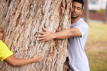 Image showing Nature, environment or couple hug tree for save the planet, deforestation support or community outreach project. Earth day sustainability, eco friendly NGO charity or volunteer protect natural growth