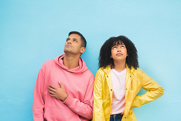 Image showing Thinking, mockup and fashion with a black couple on a blue background in studio branding or product placement. Wall, style and mock up with a man and woman posing on blank space in trendy clothes