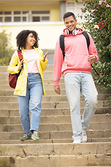 Image showing Walking, students and couple of friends talking on stairs ready for college school education. Learning, student communication and freedom of university graduate woman and man with happiness and smile