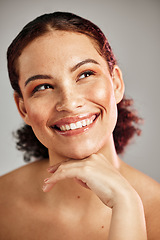 Image showing Skincare, health and woman with makeup in studio with a cosmetic, beauty or natural face routine. Happy, smile and female model with wellness or self care facial treatment isolated by gray background