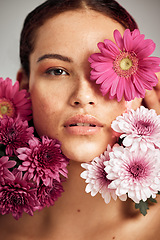 Image showing Woman, flowers and studio portrait for beauty, wellness and skincare with spring aesthetic by background. Model, girl and carnation plant with cosmetic health, natural skin glow and symbol for growth