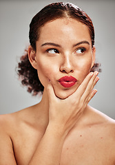Image showing Beauty, face and woman lips with lipstick and makeup, skin and natural cosmetics with red isolated on studio background. Kiss, pout and hand with manicure, spa treatment and glow with cosmetic care