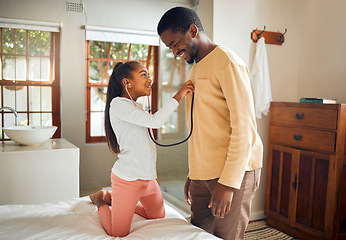 Image showing Father, girl and play with stethoscope in home, caring and bonding in bedroom. Black family, love or man with kid holding medical toy listening to heartbeat, doctor pretend and enjoying time together