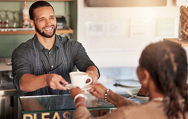 Image showing Coffee, cafe and barista serving customer a cup of latte in small business. Restaurant, cappuccino and waiter, man and server giving fresh mug of caffeine or espresso to female shopper in store.