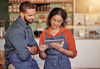 Image showing Restaurant, cafe teamwork and couple with tablet to manage orders, inventory and stock check. Diversity, waiter technology and man and woman with digital touchscreen for managing sales in coffee shop