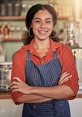 Image showing Portrait, cafe barista and woman with arms crossed ready to take your order. Coffee shop, waiter and confident, happy and proud young female waitress from Brazil or small business owner of cafeteria.