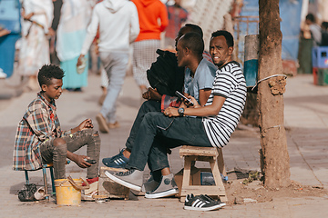 Image showing shoe cleaner on the street of Aksum, Ethiopia