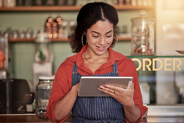 Image showing Small business, cafe barista and woman with tablet to manage orders, inventory and stock check. Coffee shop waiter, technology and happy young female waitress with touchscreen for managing sales.