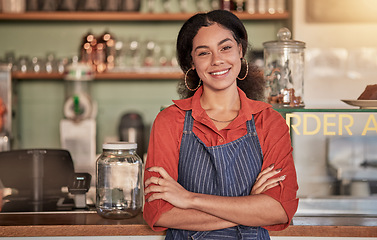 Image showing Portrait, cafe waiter and woman with arms crossed ready to take your order. Coffee shop, barista and confident, happy and proud young female employee from Brazil or small business owner of cafeteria.