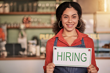 Image showing Portrait, small business or black woman with hiring sign for onboarding in a cafe or coffee shop with hospitality. Restaurant manager with a happy smile with recruitment message after opening store