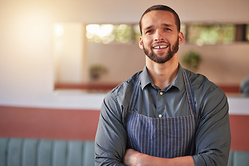 Image showing Restaurant, waiter portrait and man with arms crossed ready to take your order. Small business, server and confident, happy and proud young male employee from Brazil, worker or startup business owner