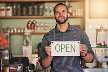 Image showing Cafe, portrait or manager with open sign to welcome sales in a small business or coffee shop. Hospitality, restaurant or proud worker with a happy smile with message on board after opening a store