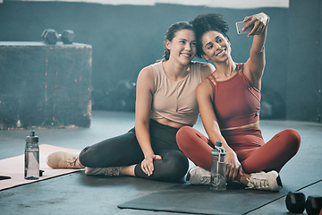 Image showing Happy woman, friends and fitness with phone for selfie, moments or picture in workout exercise or training at gym. Sporty women with smile looking at smartphone for photo or healthy wellness together