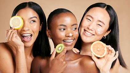 Image showing Face, fruits and women in portrait with cream for facial care, beauty and natural cosmetics isolated on studio background. Sunscreen, vegan and different skin with skincare, moisturizer and playful