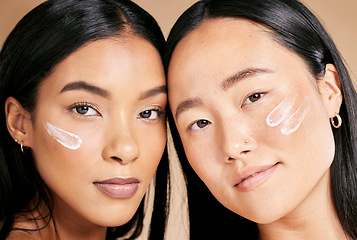 Image showing Skincare, beauty cream and diversity women portrait in studio for dermatology, makeup and cosmetics. Asian and black person together for glow, spa facial and healthy face skin of friends for wellness