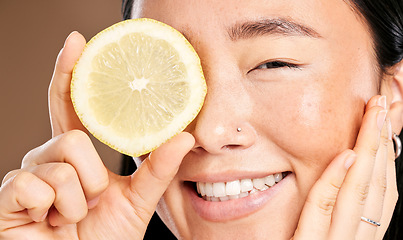 Image showing Skincare, smile and portrait of a woman with a lemon for body detox, health and wellness. Vitamin c, food and happy Japanese model with a fruit for diet, nutrition and vegan beauty dermatology