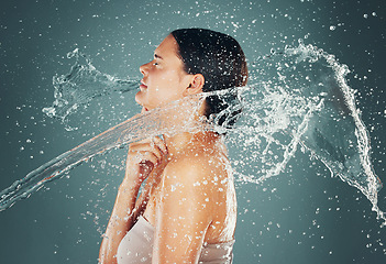 Image showing Water drop, beauty and skincare routine for woman washing skin or body for hygiene isolated in a studio background. Self care, grooming and female dermatology for young beautiful adult