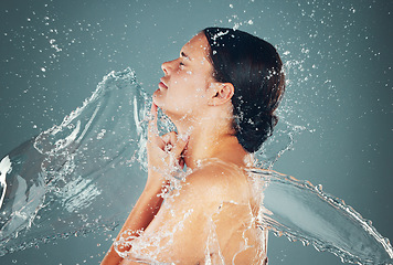 Image showing Studio, bathroom and skincare water splash on woman skin for hygiene and hydration isolated in background. Self care, dermatology and female washing to be a young beautiful adult or model