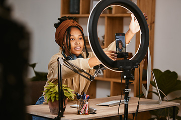 Image showing Communication, phone and influencer live streaming podcast, radio talk show or speaker talk about teen culture. Presenter microphone, black woman setup broadcast or speaking about online student news