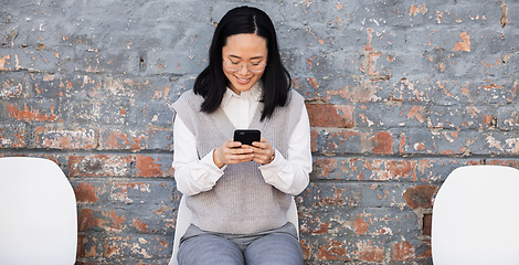 Image showing Woman texting, waiting for interview on chairs and typing on phone, recruitment and employment with smile. Happy person in Japan sitting on chair, smiling and excited for job opportunity for people.