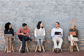 Image showing Employee diversity, interview line and conversation with technology for meeting, recruitment or company hiring. Human resources, happy business people and discussion with laptop, tablet or smartphone