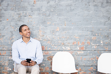 Image showing Recruitment, thinking and black man on brick wall or waiting room with career dream, opportunity or job search. Happy person sitting in line with smartphone for hiring news, interview and cv ideas