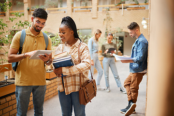 Image showing Students, college and learning, tablet and books for education, scholarship and collaboration in campus hallway. University with people studying together, learn with diversity and academic goals