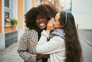 Image showing Women, laughing or whispering secret in city street, road or urban London for gossip, story or news. Smile, happy or friends talking into ear in bonding travel with funny surprise, comic or meme joke