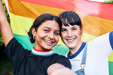 Image showing Portrait, lesbian and couple with flag for pride, freedom and happy or bonding at festival. Face, lesbian couple and rainbow flag for human rights, lgbtq and liberation while standing, love and smile