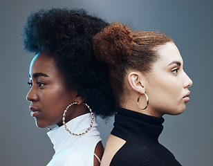 Image showing Fashion, hair care and women with futuristic diversity, cyberpunk aesthetic and isolated on a studio background. Future, creative and models modeling for a designer brand with a vision on a backdrop