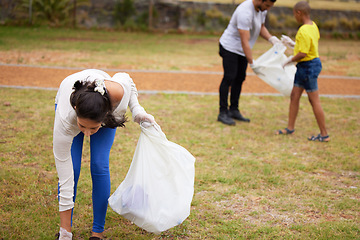 Image showing Community volunteer, garbage and people cleaning trash, pollution or waste product for environment support. Plastic recycling, NGO charity and eco friendly person helping with nature park clean up