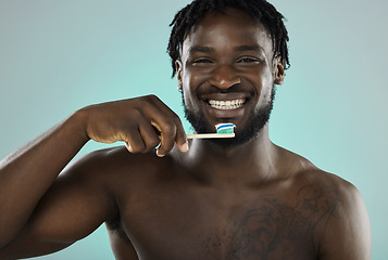 Image showing Black man, face and toothbrush with smile in portrait, teeth whitening and cleaning mouth isolated on studio background. Fresh breath, beauty and hygiene with toothpaste, health and dental wellness