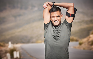 Image showing Exercise, portrait and man stretching outdoor for fitness, workout and training for energy, balance and wellness. Male person, athlete and stretch arms on road, smile and sports for healthy lifestyle