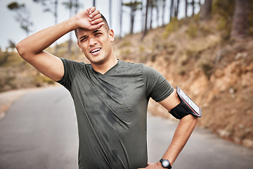 Image showing Tired, fitness and running man portrait of a marathon runner on a road feeling fatigue from workout. Exercise, athlete and sports person breathing from a health, wellness and cardio training