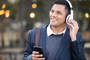 Image showing Headphones, business man and outdoor phone listening with music streaming ready for work. Radio, mobile 5g connection and young professional with web podcast on technology and internet with bokeh